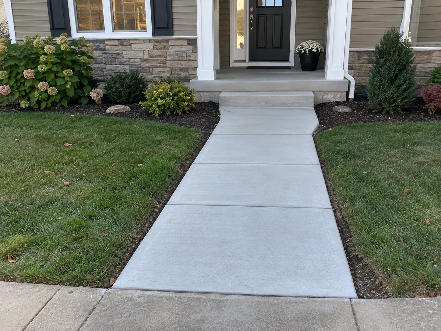 Newly replaced front entrance walkway after concrete work